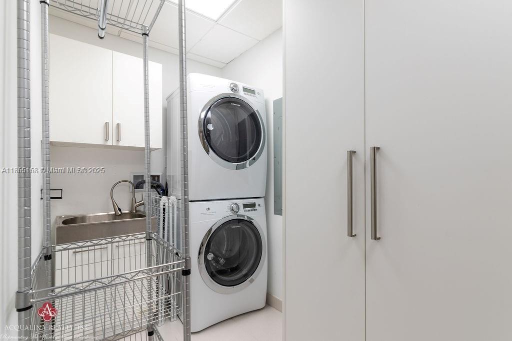 17749 Collins Avenue, Unit 902 Sunny Isles Beach, FL 33160 - Photo 65 of 82 a utility room with dryer and washer