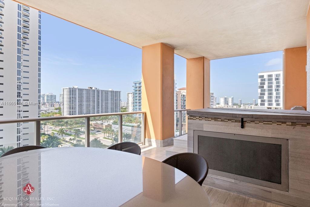 17749 Collins Avenue, Unit 902 Sunny Isles Beach, FL 33160 - Photo 68 of 82 a view of a bedroom with furniture and large windows
