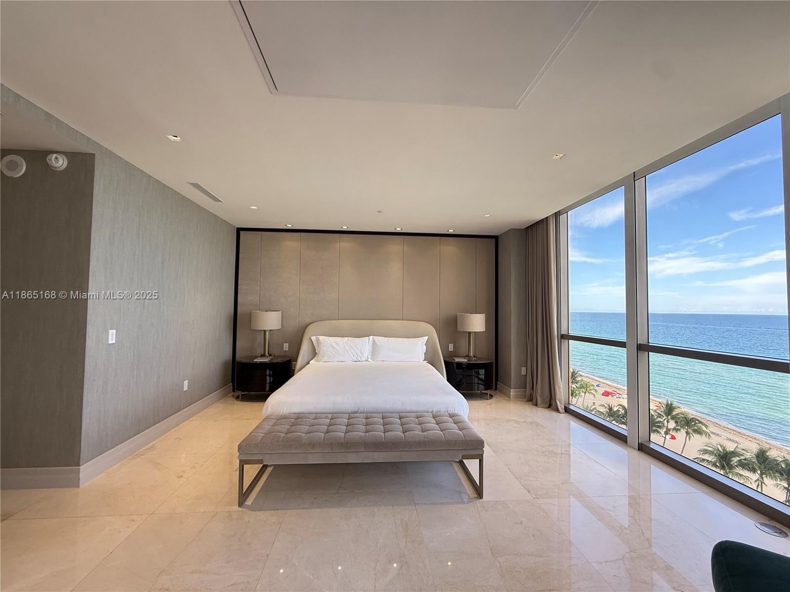 17749 Collins Avenue, Unit 902 Sunny Isles Beach, FL 33160 - Photo 79 of 82 a bedroom with a bed and large window