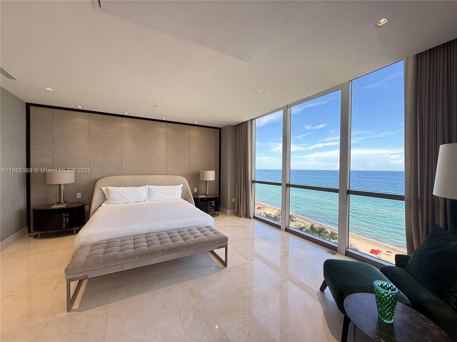 17749 Collins Avenue, Unit 902 Sunny Isles Beach, FL 33160 - Photo 81 of 82 a bedroom with a bed and large window