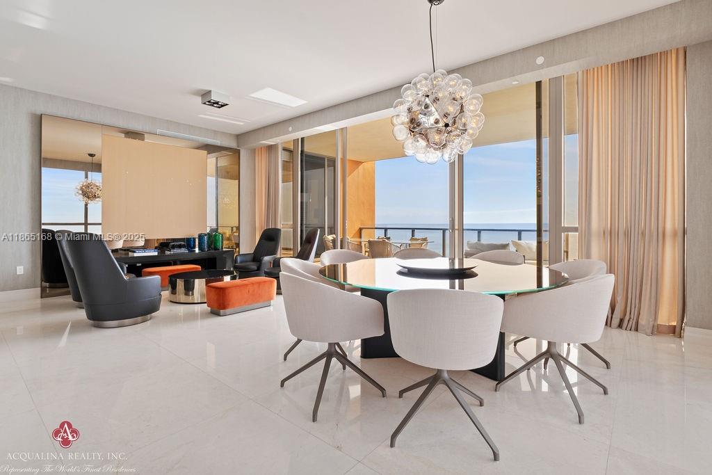 17749 Collins Avenue, Unit 902 Sunny Isles Beach, FL 33160 - Photo 9 of 82 a view of a dining room with furniture window and outside view