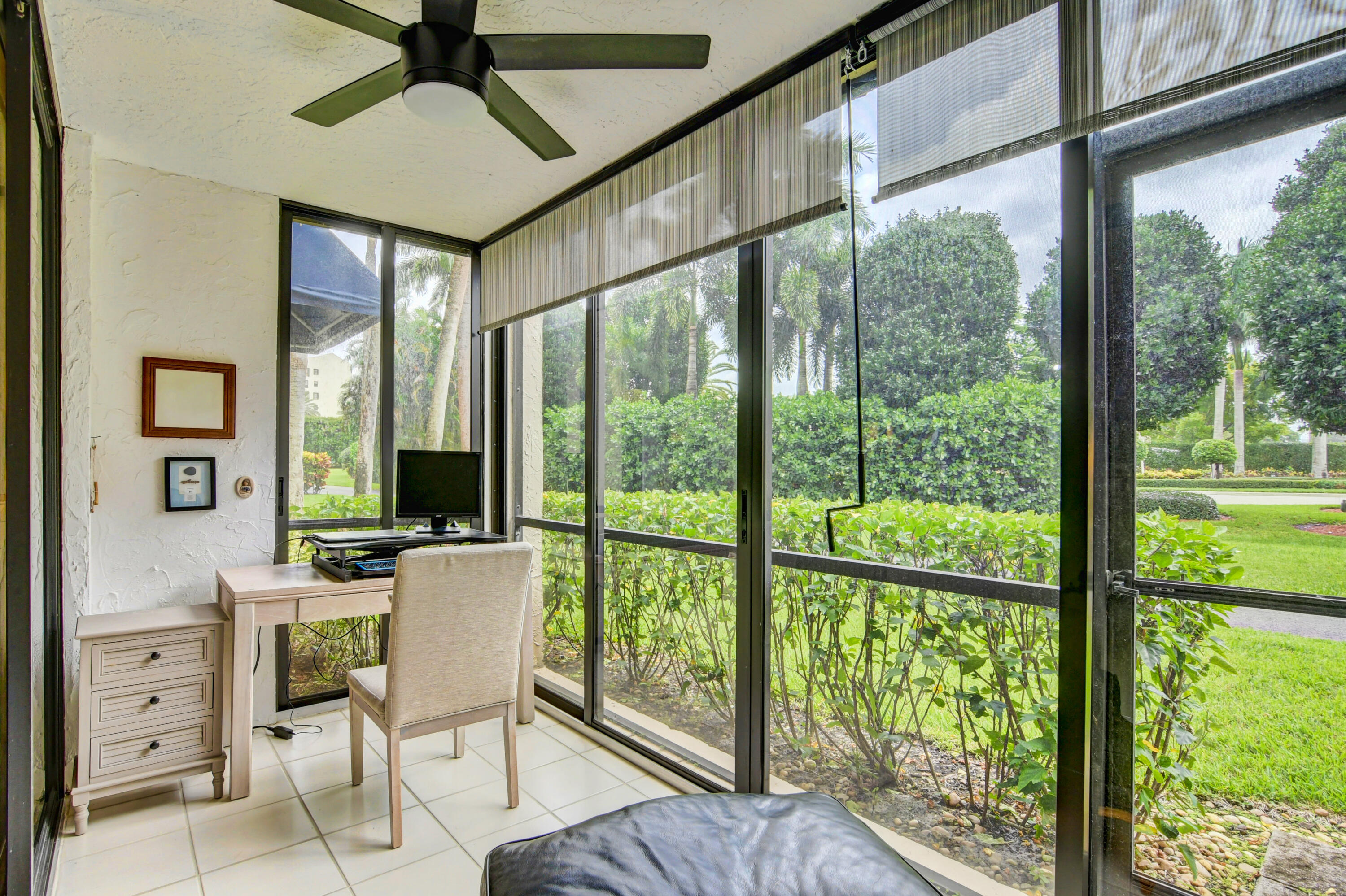 7568 Regency Lake Drive, Unit B101 Boca Raton, FL 33433 - Photo 28 of 37 East Glass Enclosed Sun Room