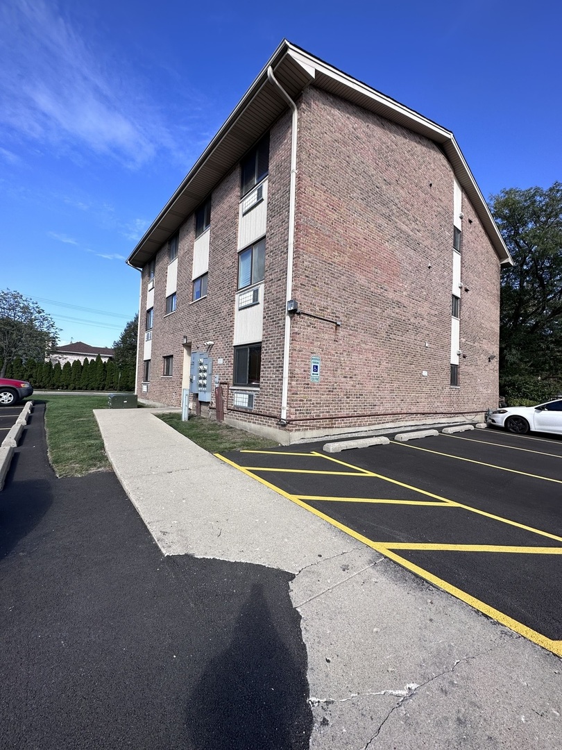 270 12th Street, Unit 2D Wheeling, IL 60090 - Photo 3 of 12 a view of a building with a street