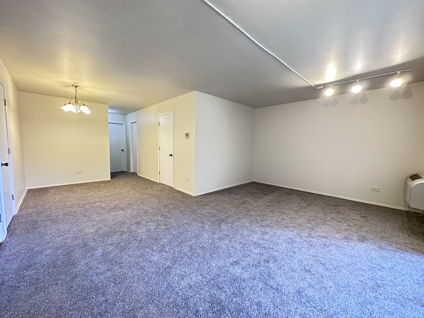270 12th Street, Unit 2D Wheeling, IL 60090 - Photo 9 of 12 an empty room with a empty space and windows