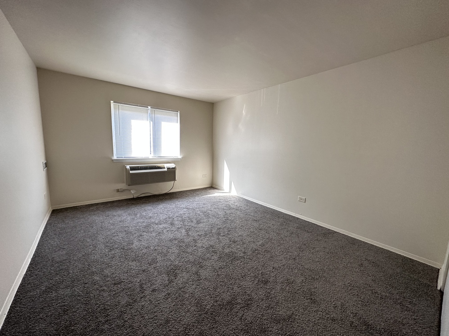 270 12th Street, Unit 2D Wheeling, IL 60090 - Photo 10 of 12 a view of a room with window