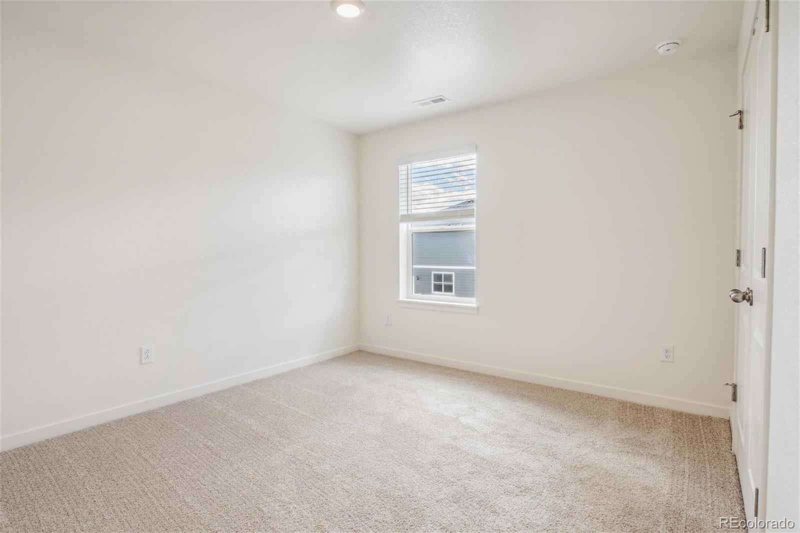 3482 Belleville Ridge Road Elizabeth, CO 80107 - Photo 18 of 21 a view of an empty room with a window