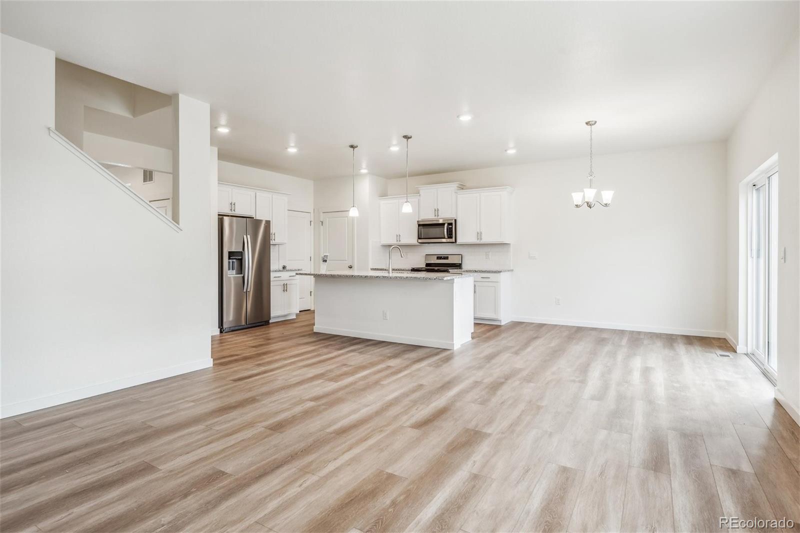 3482 Belleville Ridge Road Elizabeth, CO 80107 - Photo 9 of 21 a view of kitchen view wooden floor and stainless steel appliances