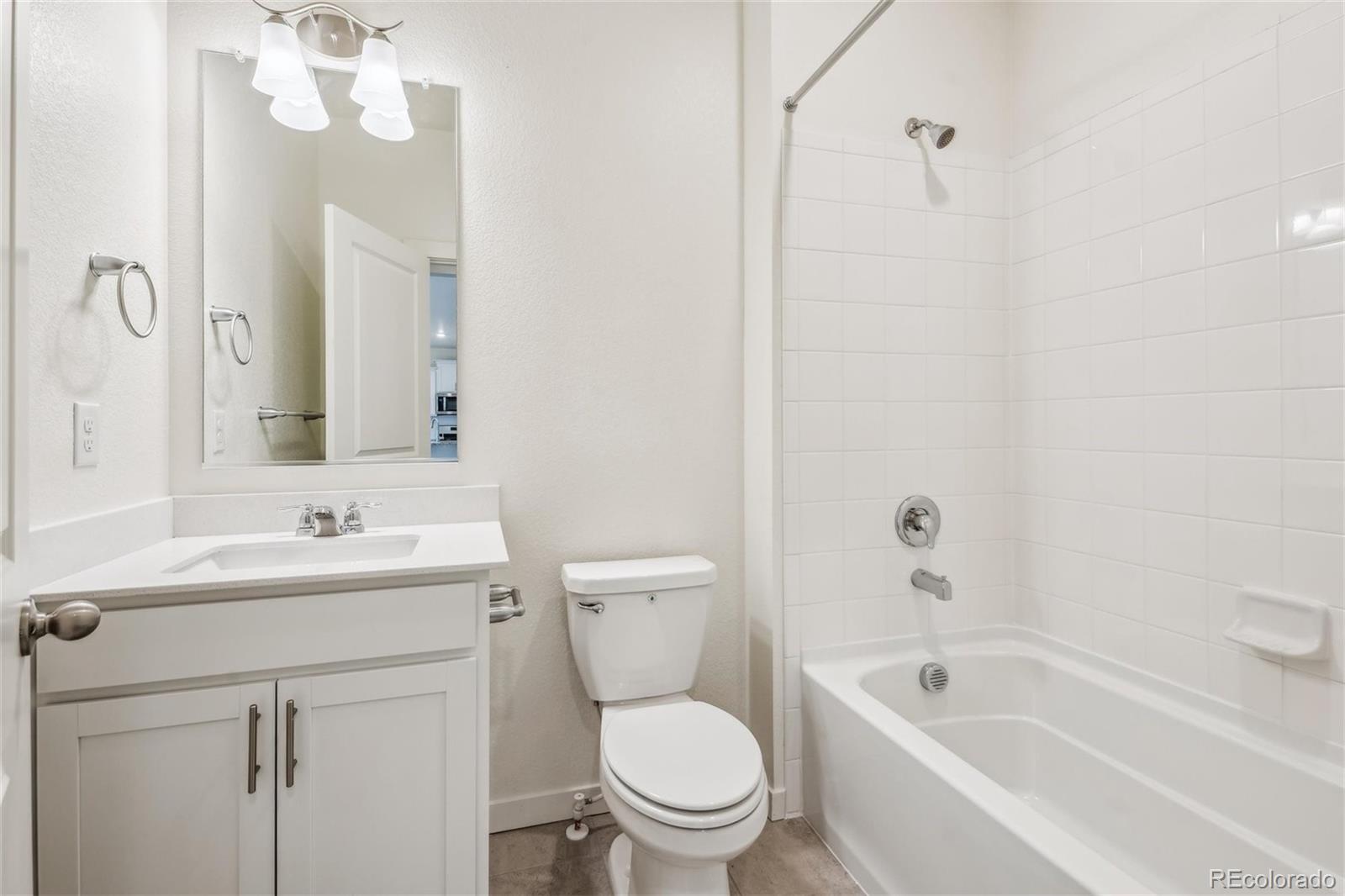 3482 Belleville Ridge Road Elizabeth, CO 80107 - Photo 10 of 21 a bathroom with a sink a toilet and a bathtub