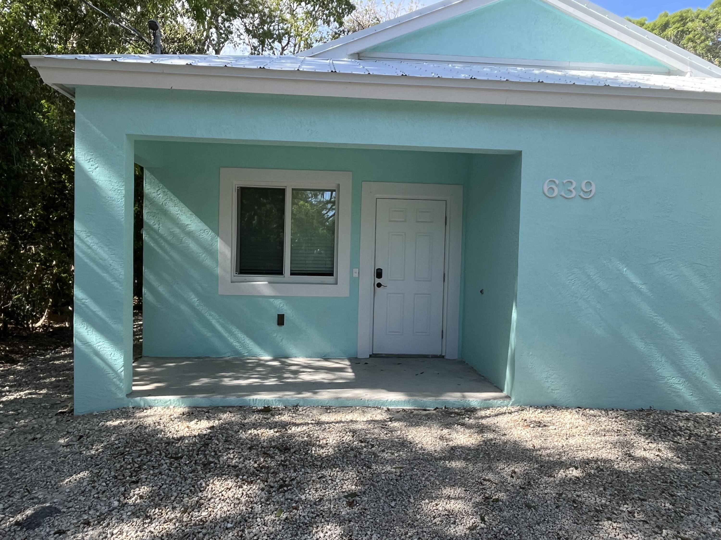 639 Cabrera Street Key Largo, FL 33037 - Photo 4 of 24 a view of a house with a backyard