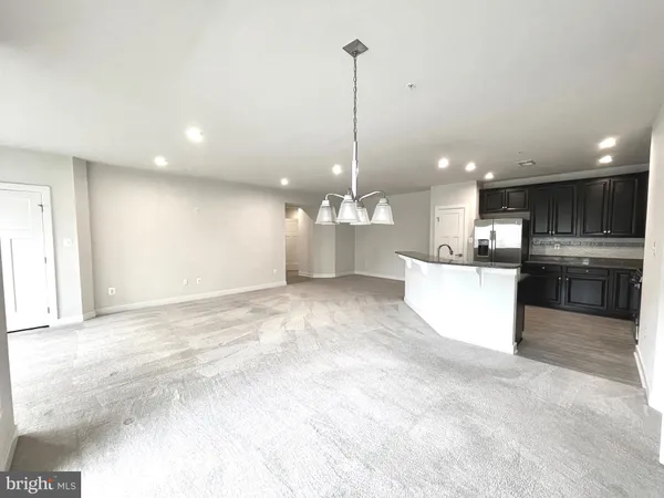 a view of empty room with floor to ceiling window