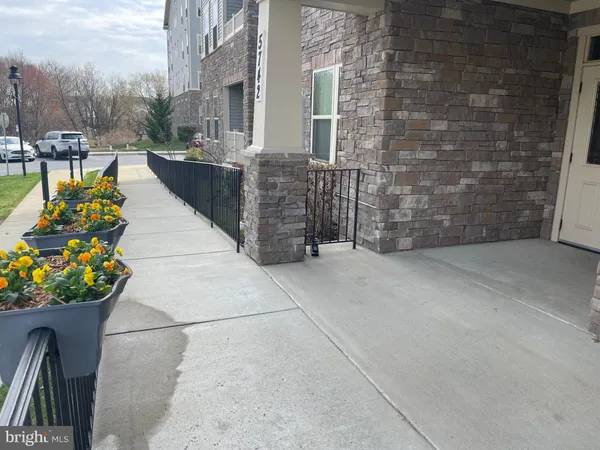 a room with painting on the wall and a mirror