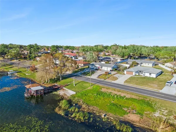 an aerial view of a house with a ocean view