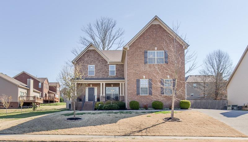 1007 Beverly Road Spring Hill, TN 37174 - Photo 1 of 24 a front view of a house with a yard