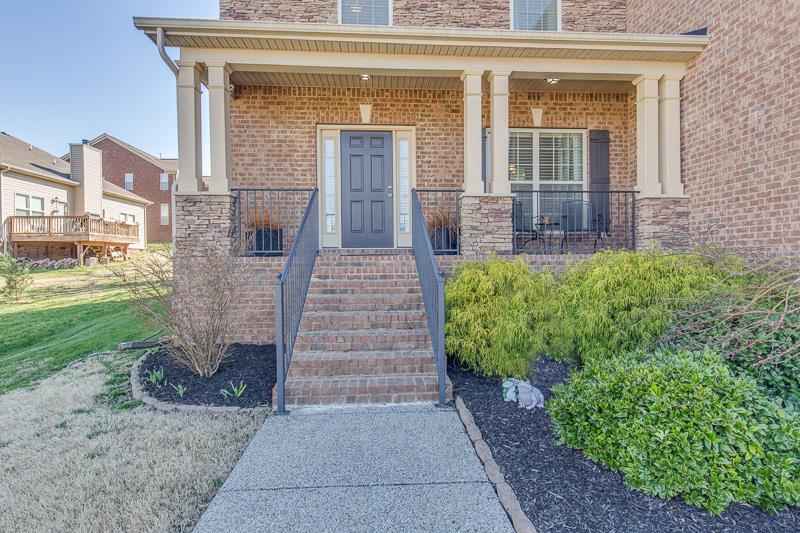 1007 Beverly Road Spring Hill, TN 37174 - Photo 2 of 24 front view of a house with a yard