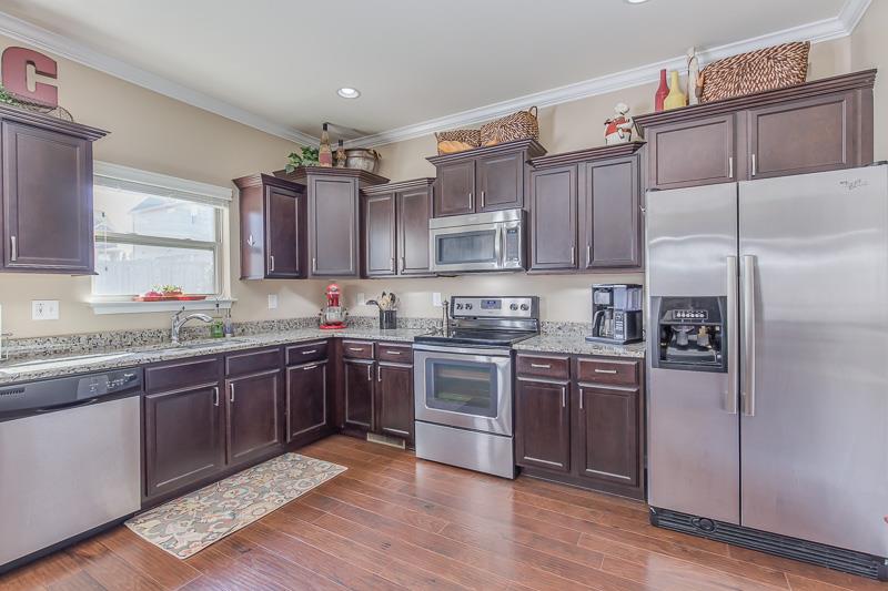 1007 Beverly Road Spring Hill, TN 37174 - Photo 12 of 24 a kitchen with kitchen island granite countertop wooden cabinets and a stainless steel appliances