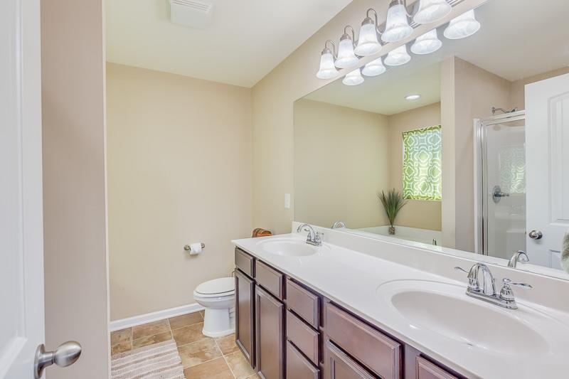 1007 Beverly Road Spring Hill, TN 37174 - Photo 15 of 24 a bathroom with a sink a toilet and a large mirror