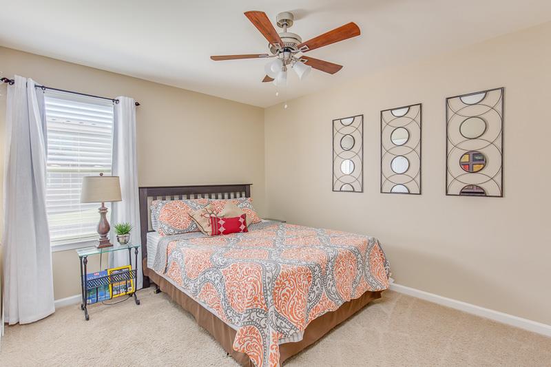 1007 Beverly Road Spring Hill, TN 37174 - Photo 17 of 24 a bedroom with a bed and a table in it