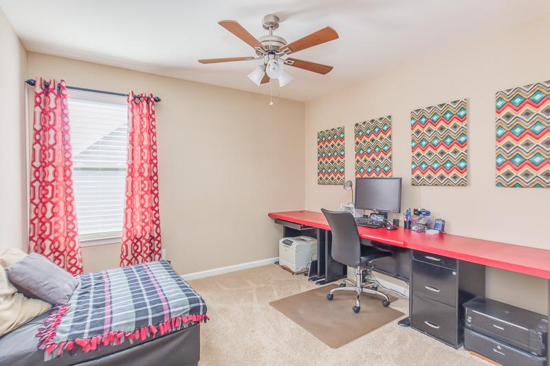 1007 Beverly Road Spring Hill, TN 37174 - Photo 19 of 24 a bedroom with a bed and a chandelier