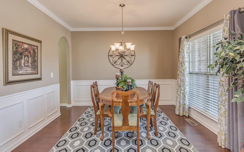 1007 Beverly Road Spring Hill, TN 37174 - Photo 3 of 24 a dining room with chandelier and wooden floor