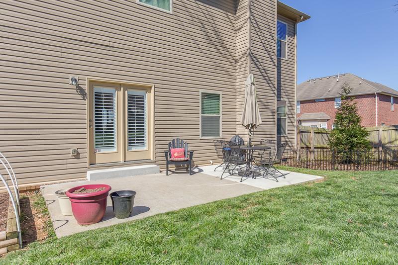 1007 Beverly Road Spring Hill, TN 37174 - Photo 24 of 24 a backyard of a house with outdoor seating