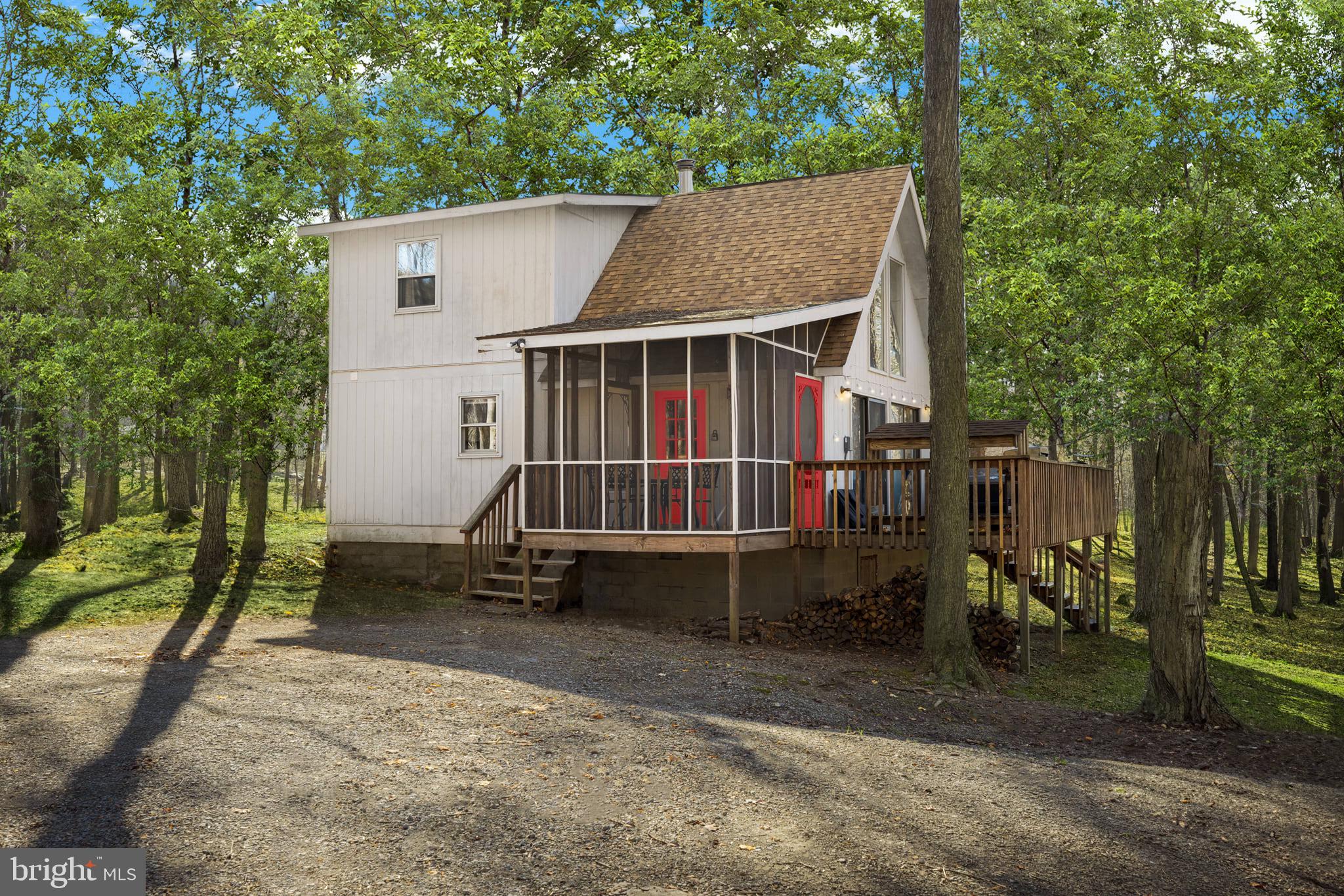 126 Flagstone Lane Berkeley Springs, WV 25411 - Photo 27 of 28 an outdoor view of house with backyard