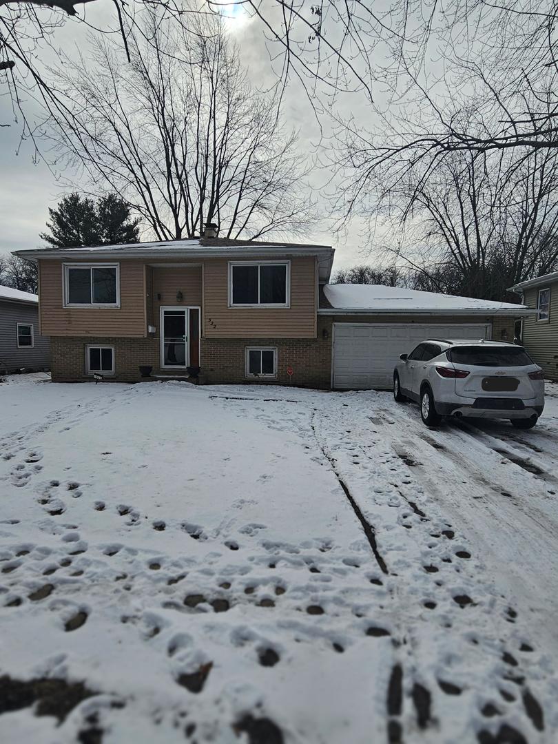 522 Manor Place Aurora, IL 60506 - Photo 1 of 16 a front view of a house with a yard