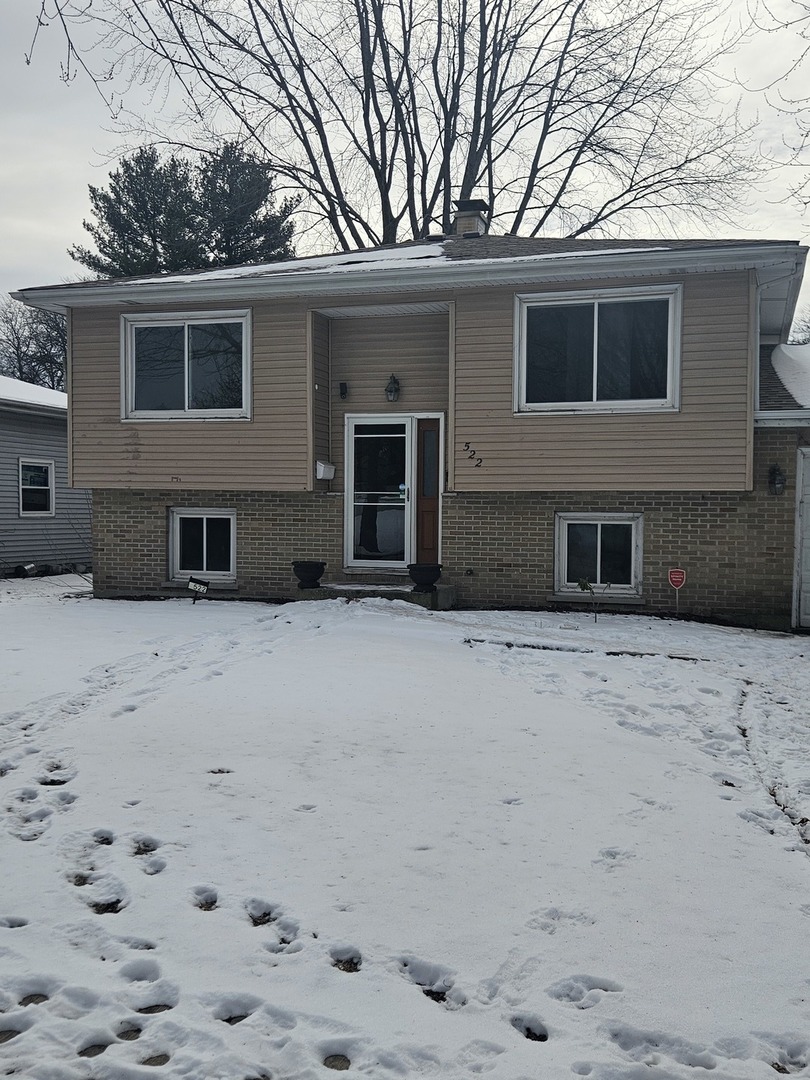 522 Manor Place Aurora, IL 60506 - Photo 2 of 16 a house that has a tree in front of it