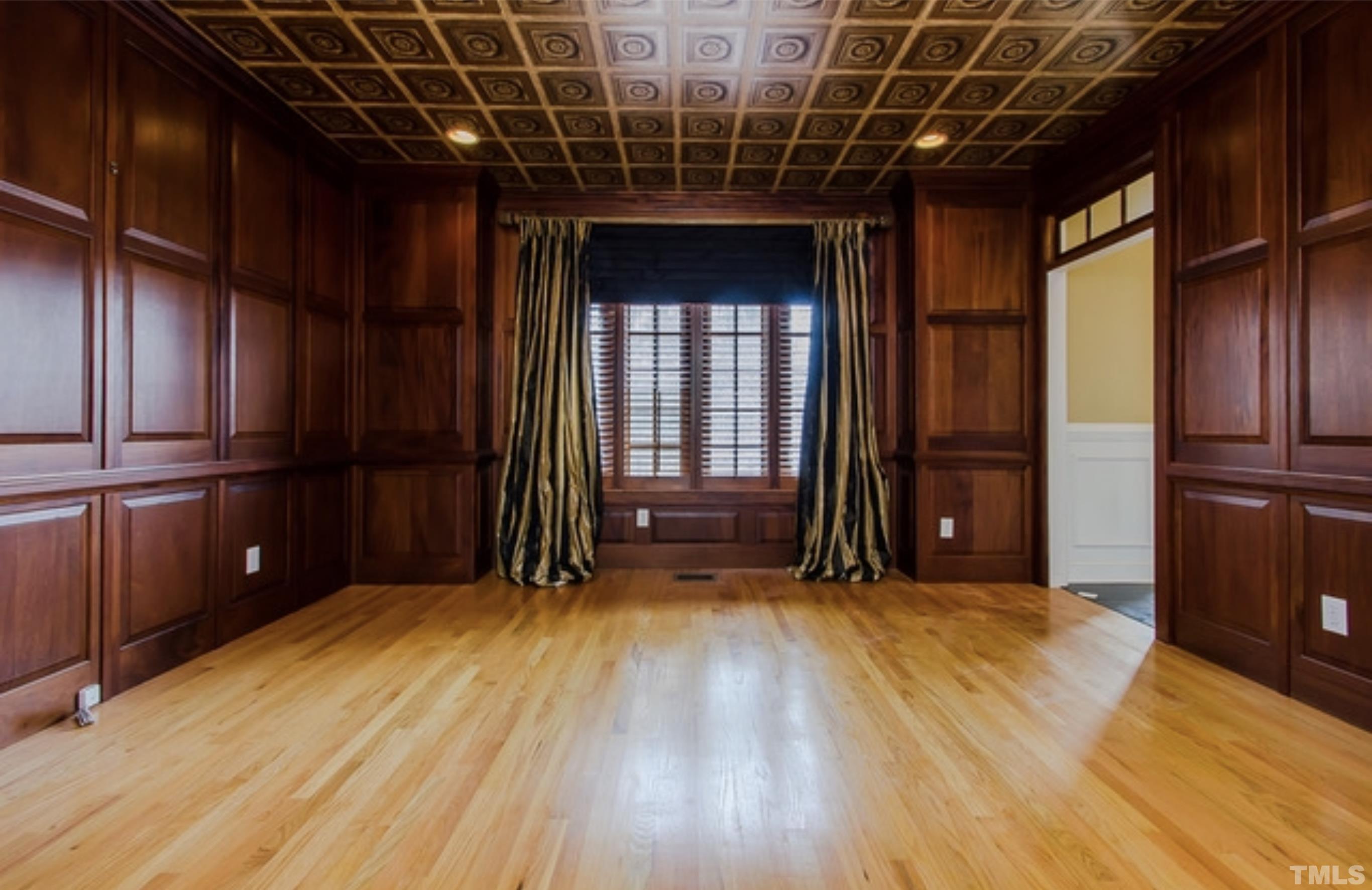 4009 George V Strong Wynd Raleigh, NC 27612 - Photo 2 of 41 a view of an empty room with wooden floor and a window
