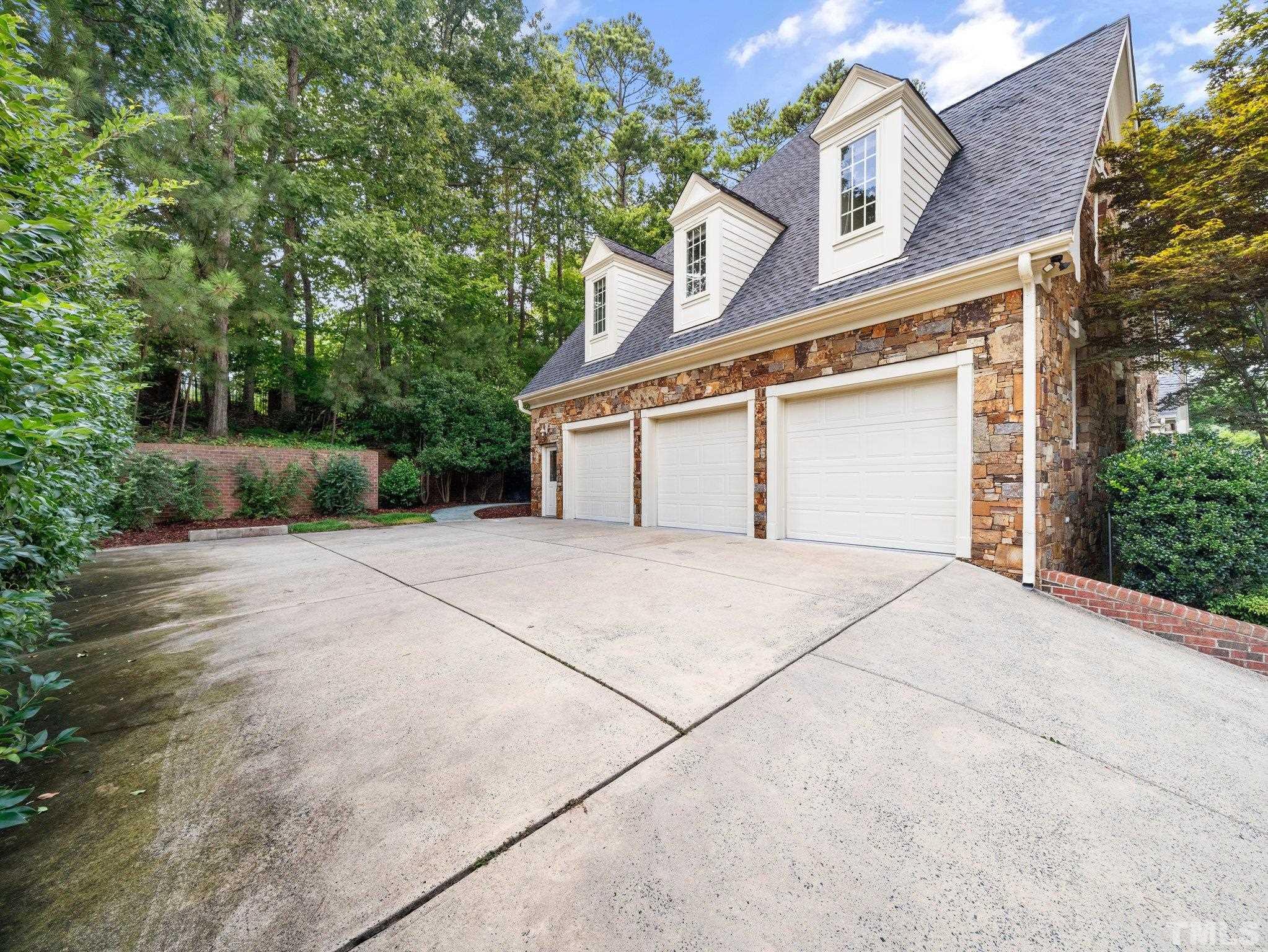 4009 George V Strong Wynd Raleigh, NC 27612 - Photo 33 of 41 front view of a house with a garage