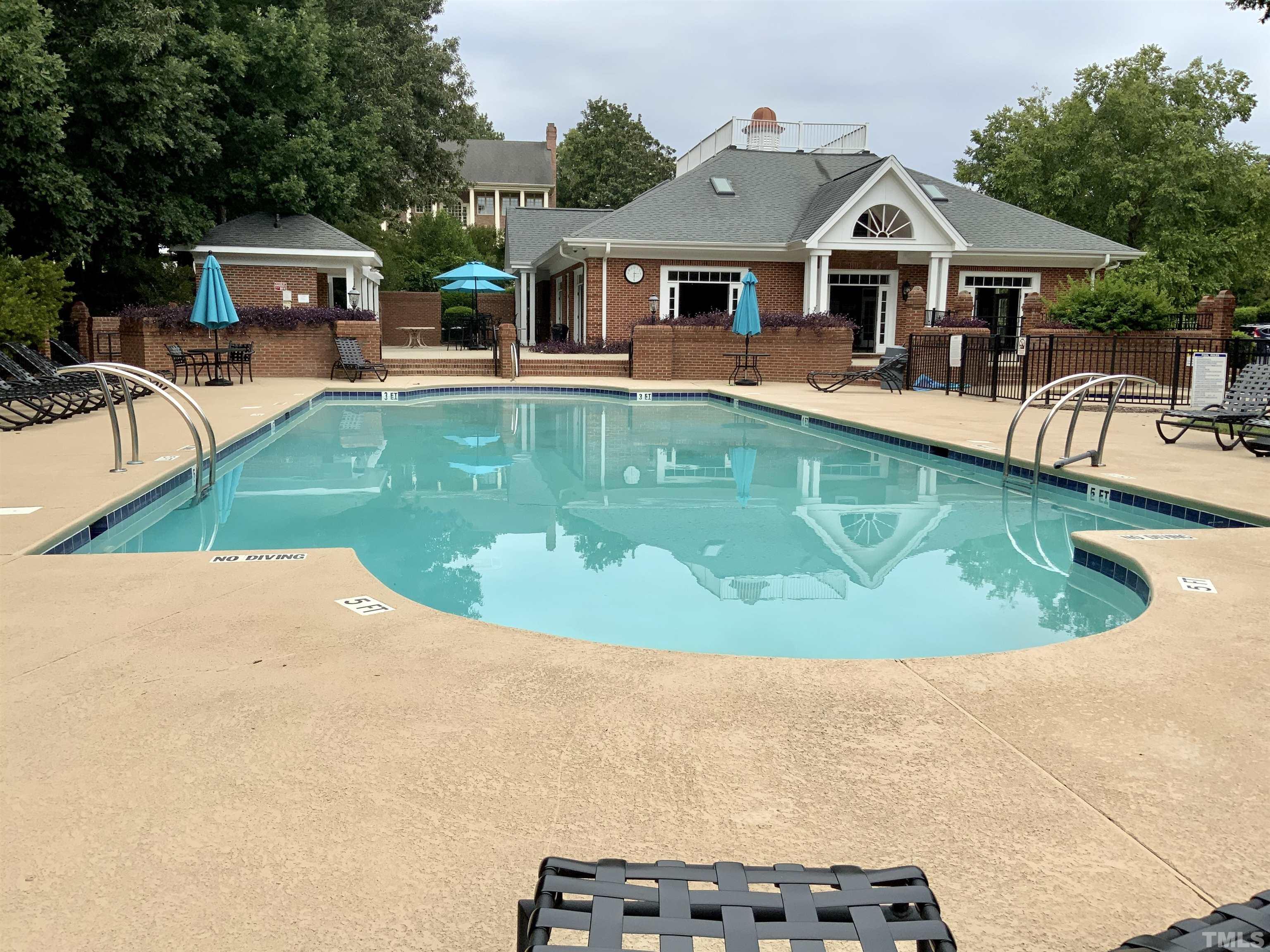 4009 George V Strong Wynd Raleigh, NC 27612 - Photo 8 of 41 swimming pool view with a seating space and a garden view
