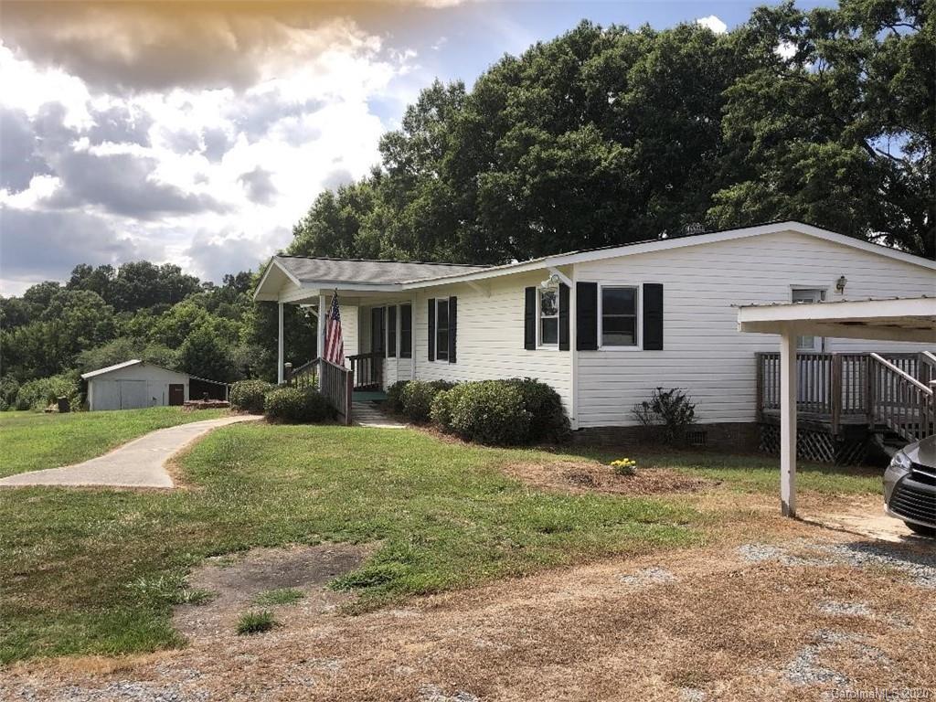 901 Clontz Long Road Monroe, NC 28110 - Photo 1 of 35 a view of a house with backyard and sitting area