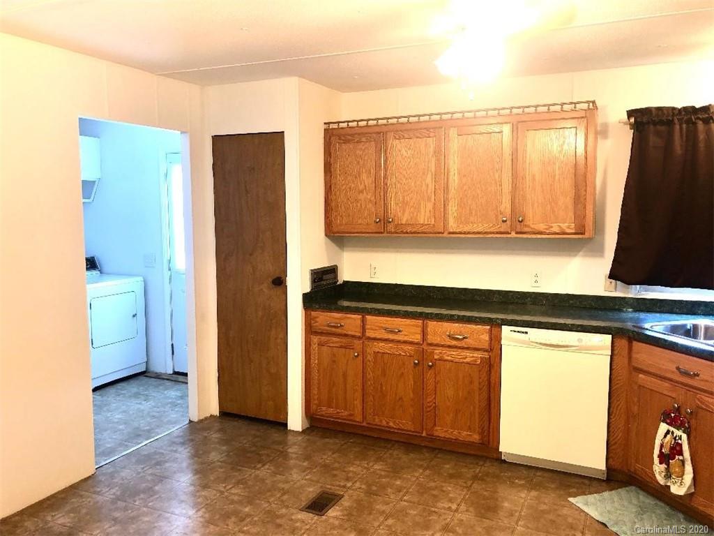 901 Clontz Long Road Monroe, NC 28110 - Photo 16 of 35 a kitchen with a refrigerator and a sink