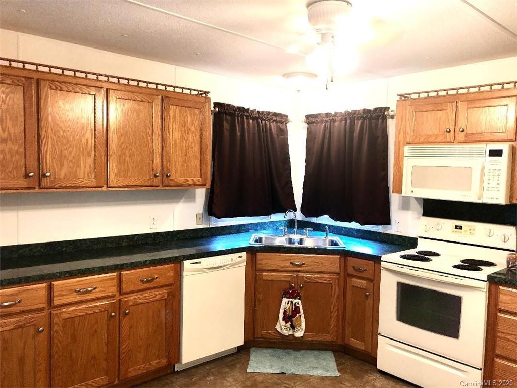 901 Clontz Long Road Monroe, NC 28110 - Photo 17 of 35 a kitchen with a stove and a microwave