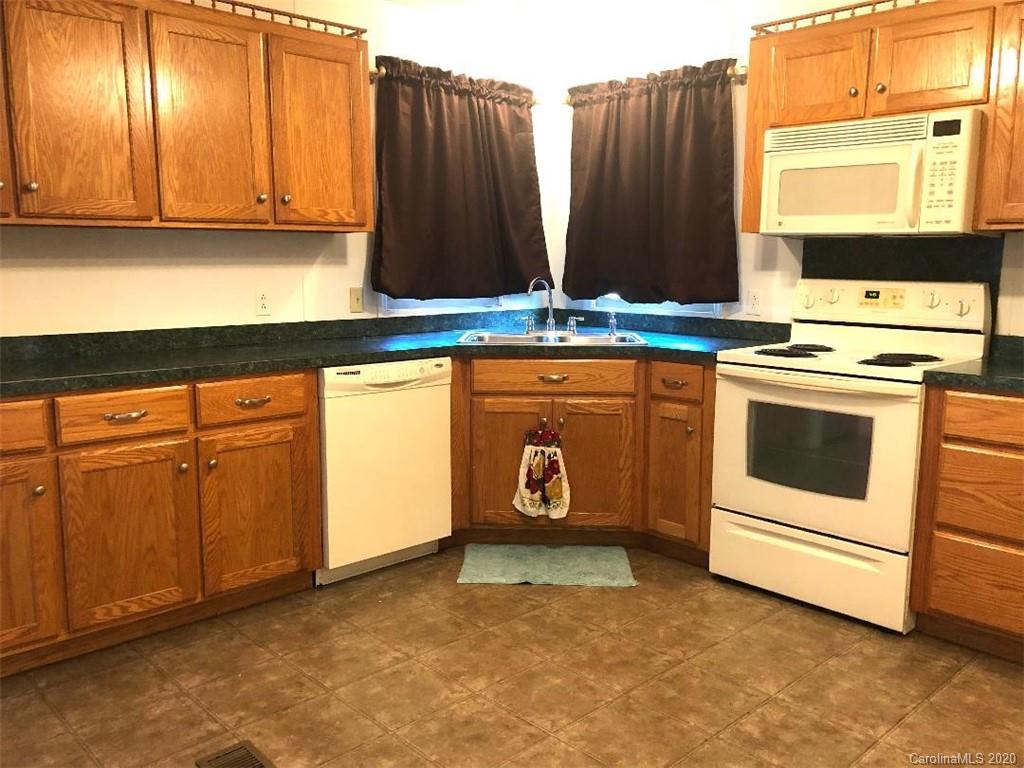 901 Clontz Long Road Monroe, NC 28110 - Photo 18 of 35 a view of kitchen with stainless steel appliances granite countertop cabinets and a window