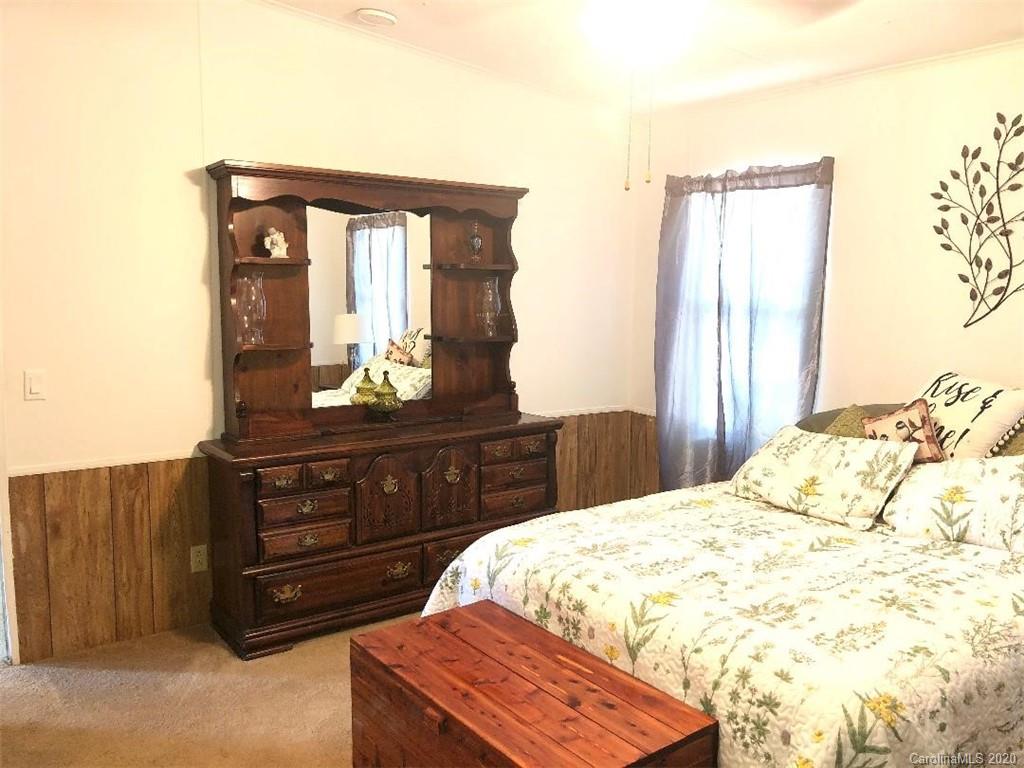 901 Clontz Long Road Monroe, NC 28110 - Photo 22 of 35 a bedroom with a bed and a dresser