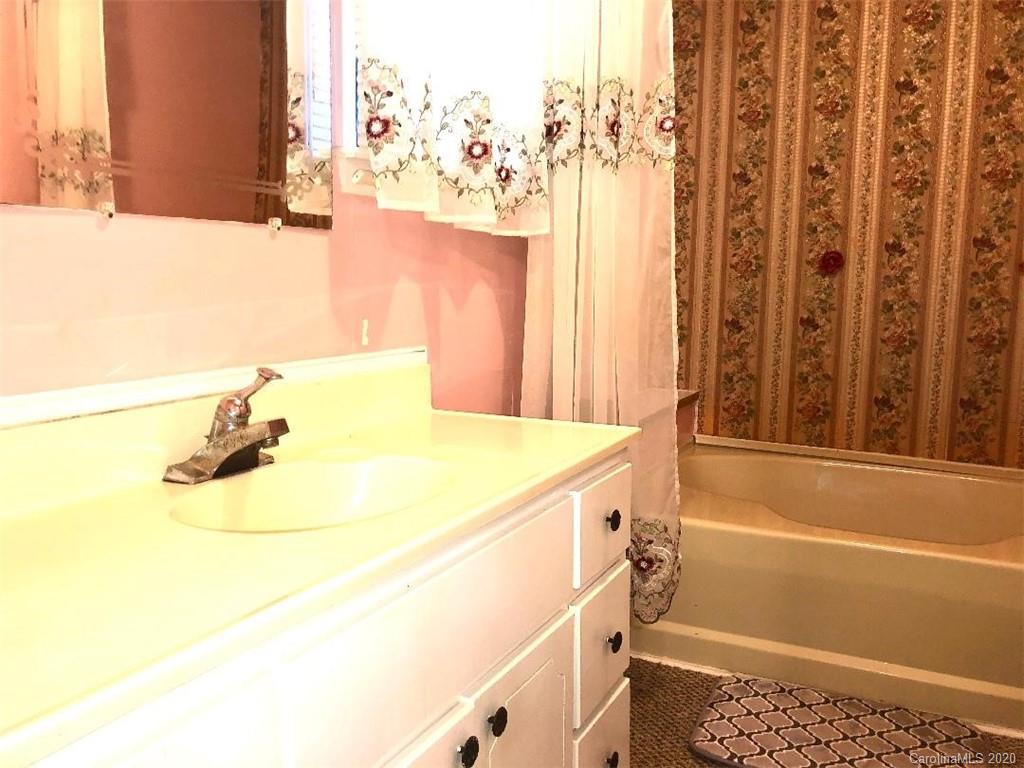 901 Clontz Long Road Monroe, NC 28110 - Photo 23 of 35 a bathroom with a tub and a shower