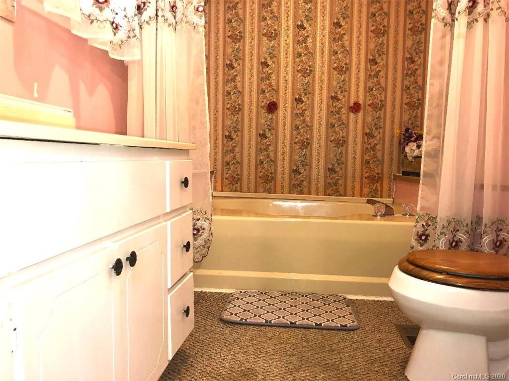 901 Clontz Long Road Monroe, NC 28110 - Photo 24 of 35 a bathroom with a sink a toilet and a bathtub