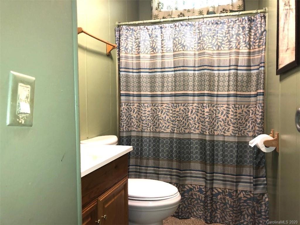 901 Clontz Long Road Monroe, NC 28110 - Photo 31 of 35 a bathroom with a sink a toilet and shower