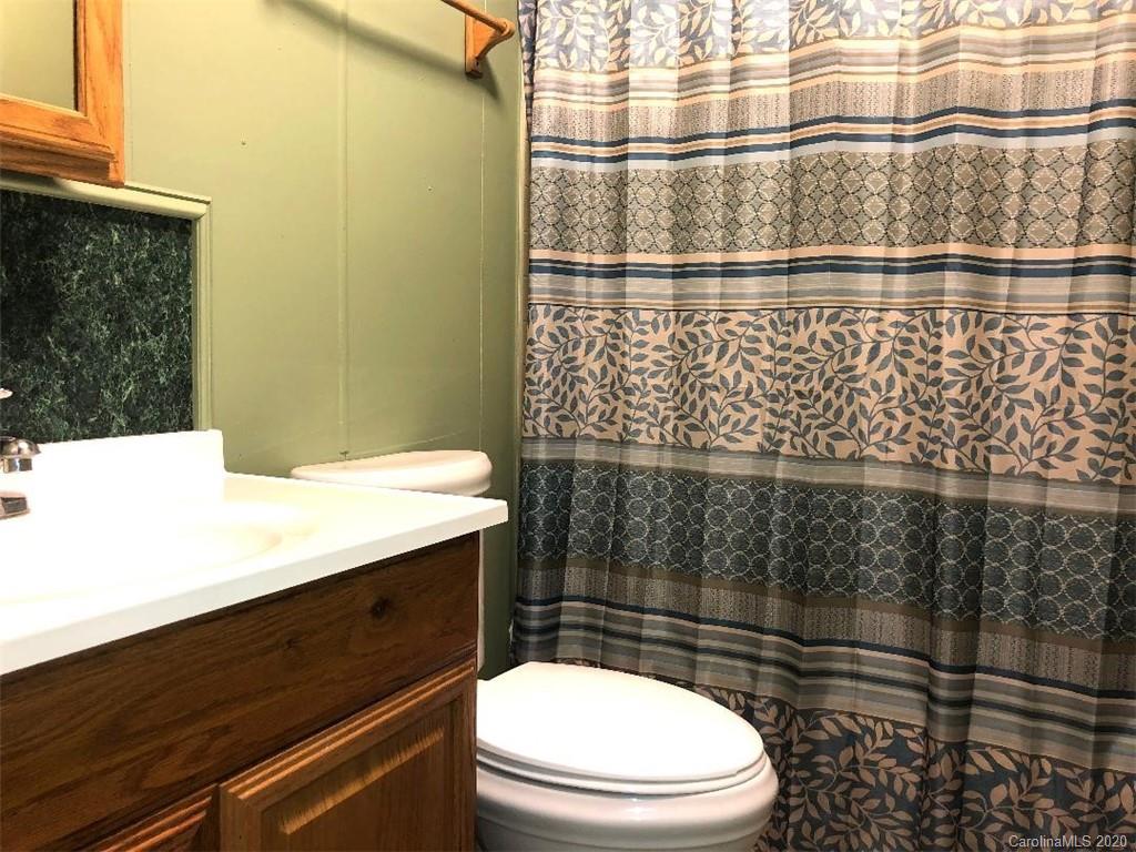 901 Clontz Long Road Monroe, NC 28110 - Photo 32 of 35 a bathroom with a sink a toilet and shower
