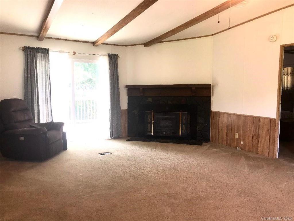 901 Clontz Long Road Monroe, NC 28110 - Photo 10 of 35 a living room with furniture and a fireplace
