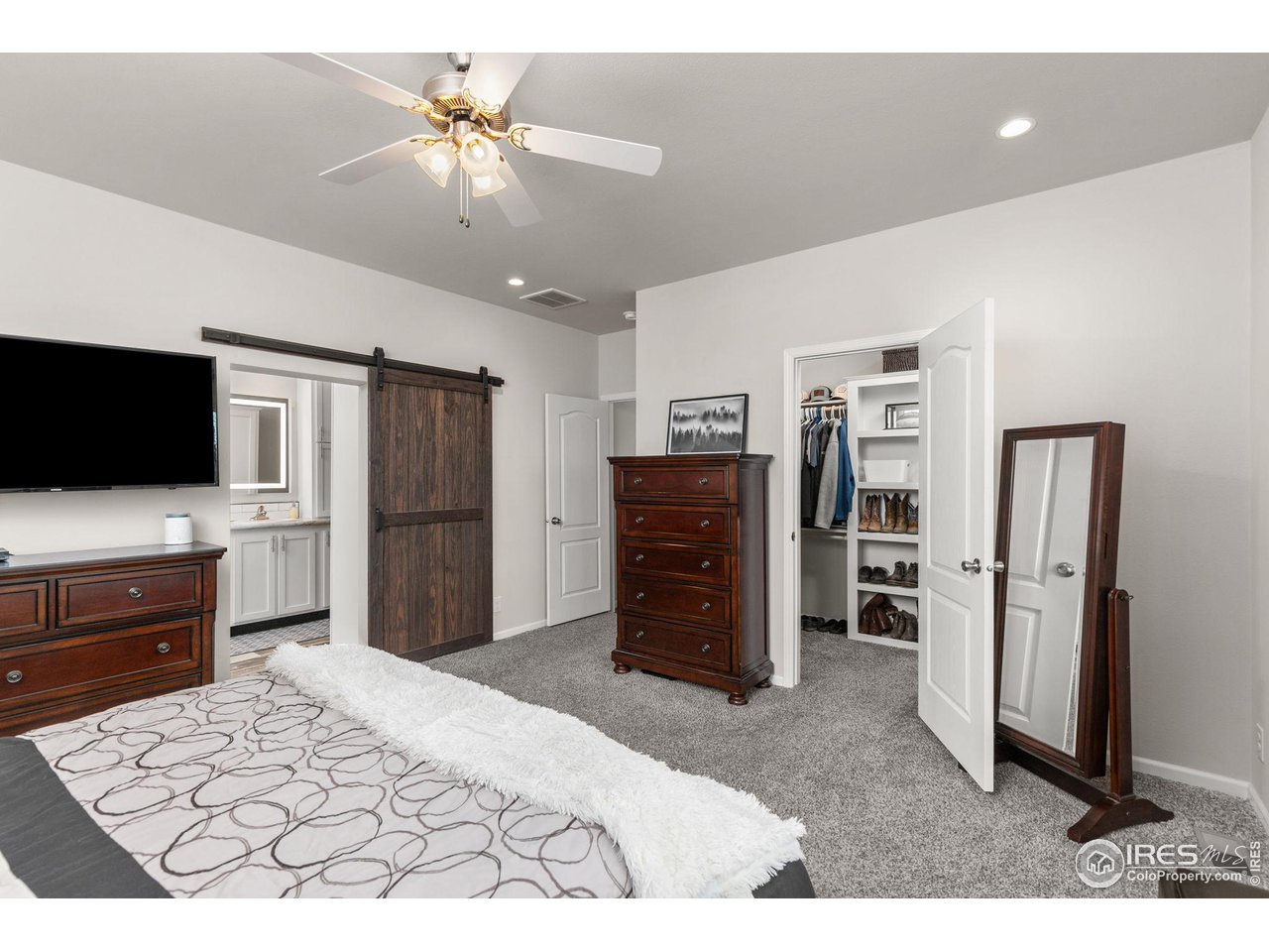 16244 County Road 94 Pierce, CO 80650 - Photo 14 of 37 a bedroom with a bed and a television