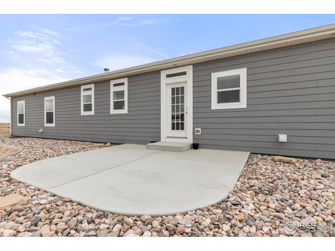 16244 County Road 94 Pierce, CO 80650 - Photo 25 of 37 a view of a house with a backyard