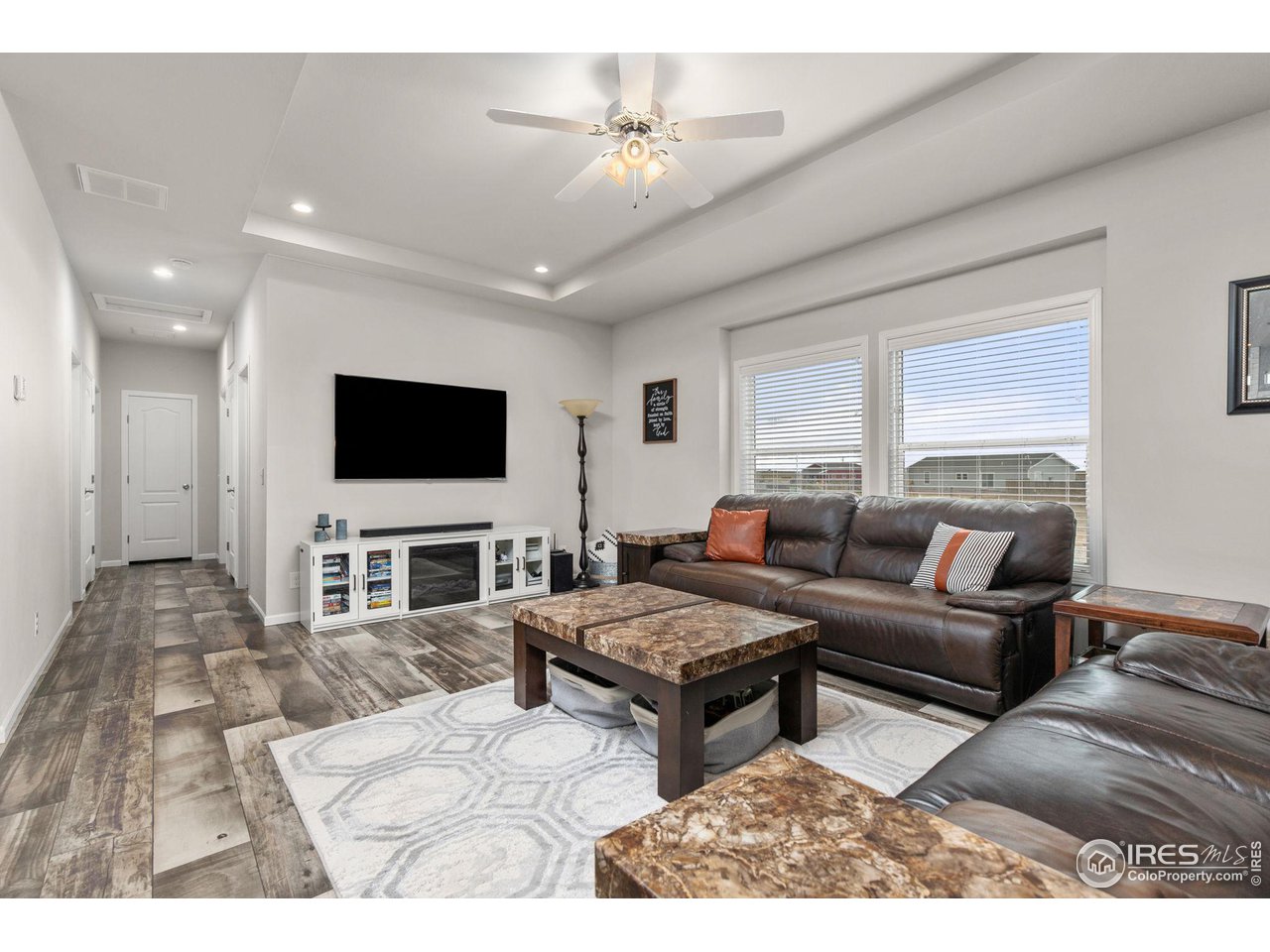 16244 County Road 94 Pierce, CO 80650 - Photo 9 of 37 a living room with furniture and a flat screen tv