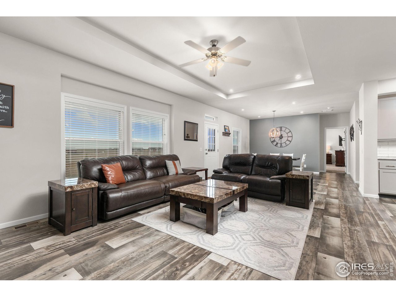 16244 County Road 94 Pierce, CO 80650 - Photo 10 of 37 a living room with furniture and a chandelier