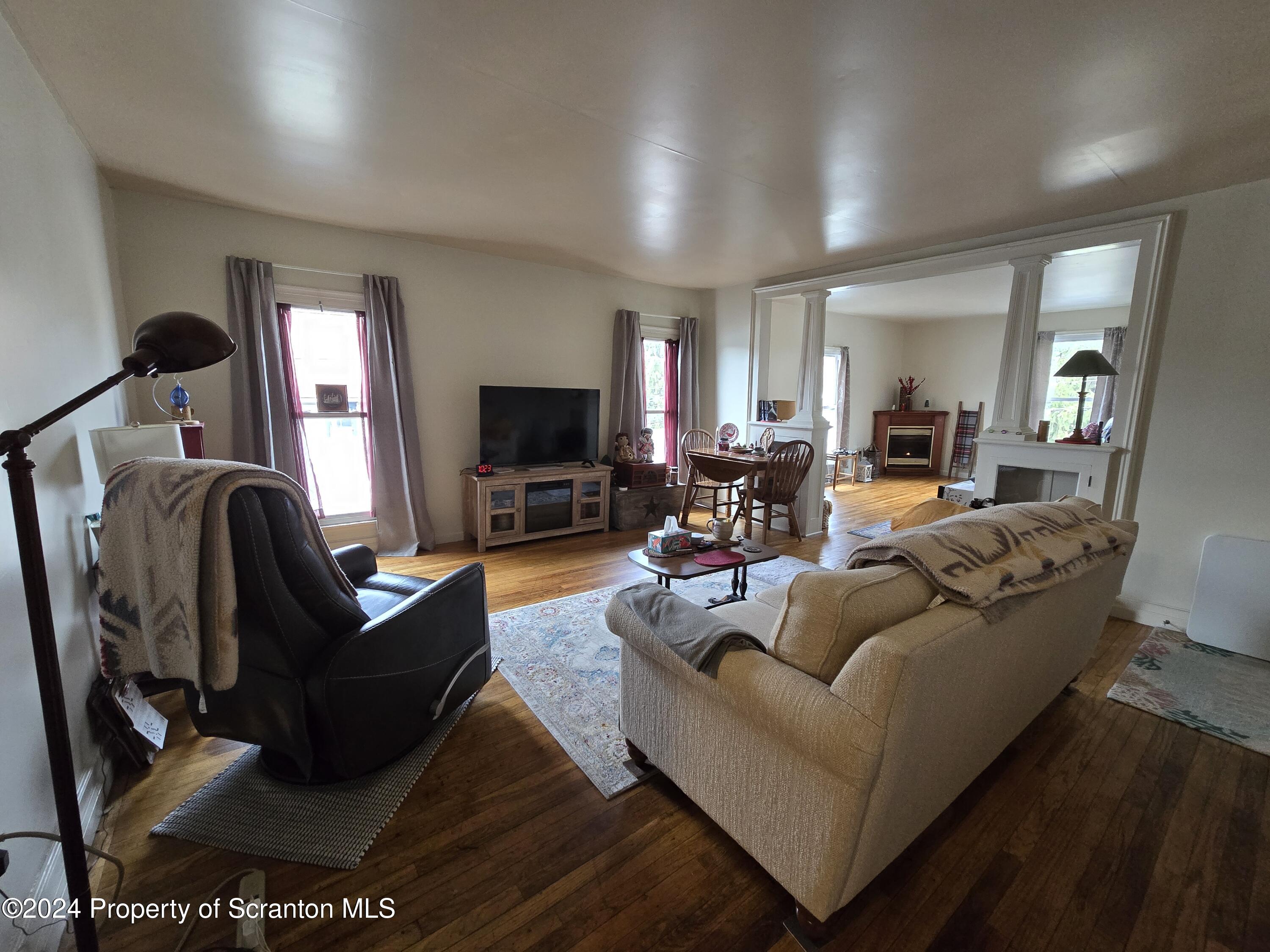 118 Main Street Hop Bottom, PA 18824 - Photo 13 of 35 a living room with furniture and a flat screen tv