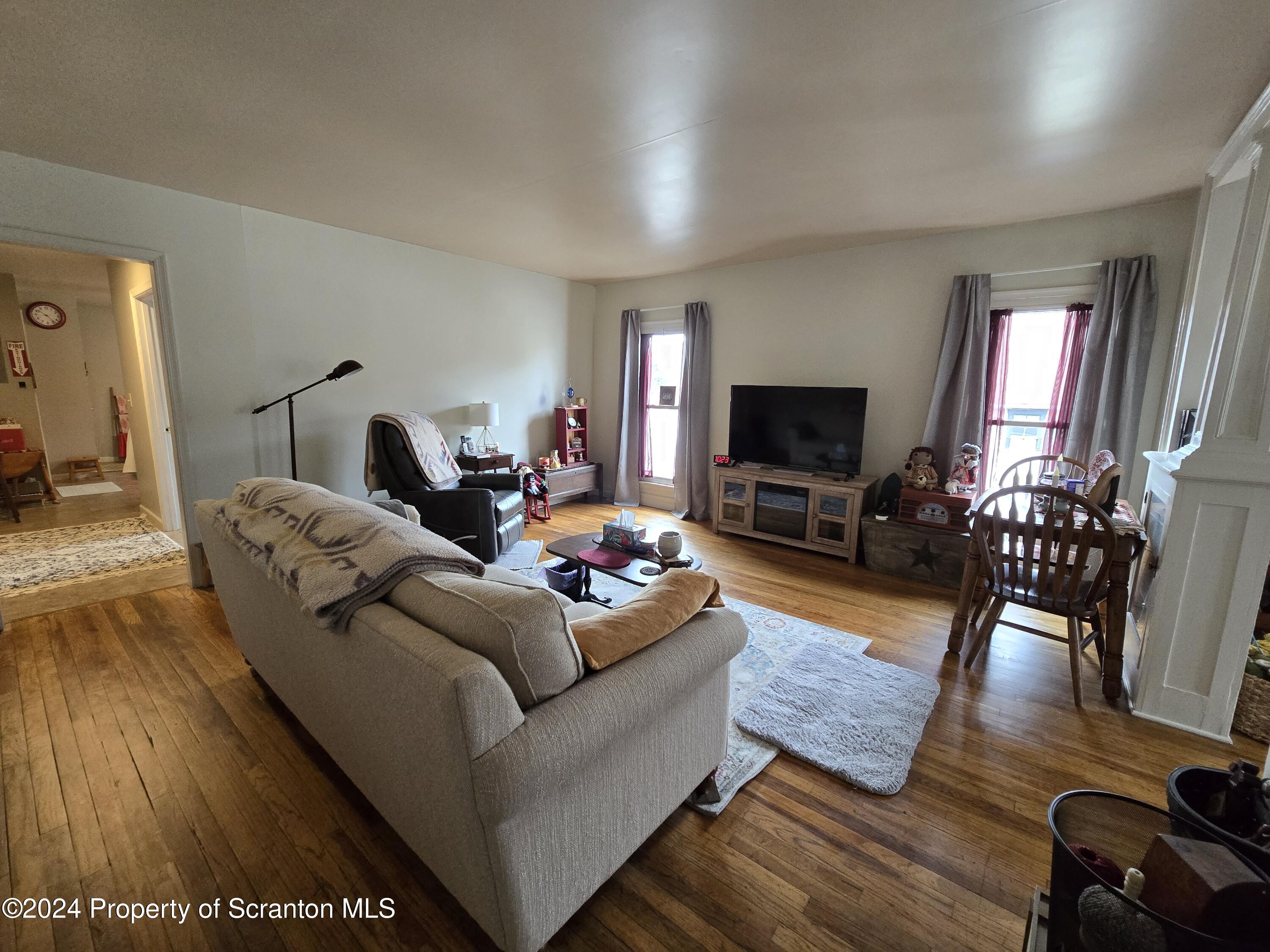 118 Main Street Hop Bottom, PA 18824 - Photo 14 of 35 a living room with furniture and a flat screen tv