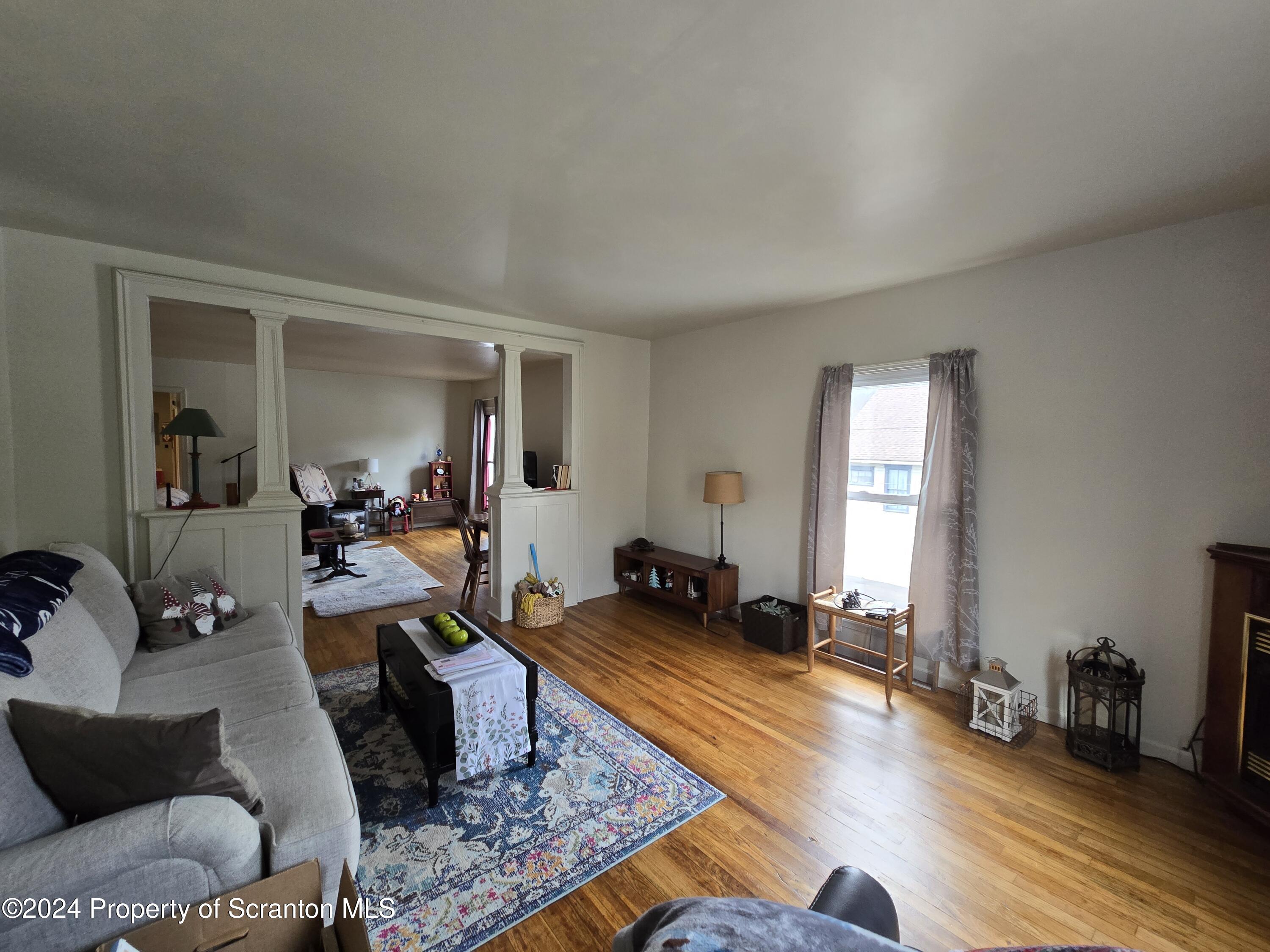 118 Main Street Hop Bottom, PA 18824 - Photo 19 of 35 a living room with furniture or couch and a window