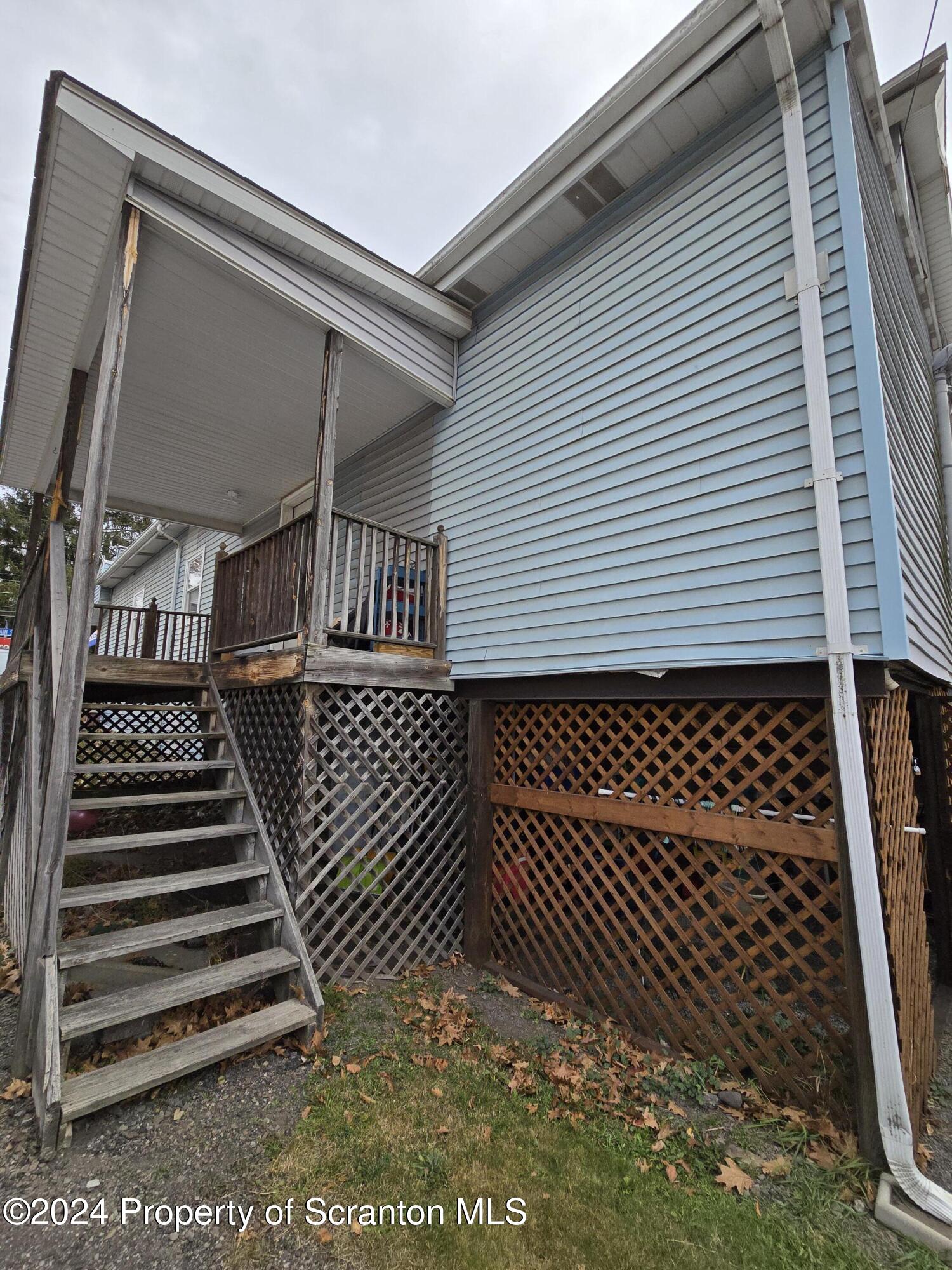 118 Main Street Hop Bottom, PA 18824 - Photo 3 of 35 a view of a wooden roof with windows