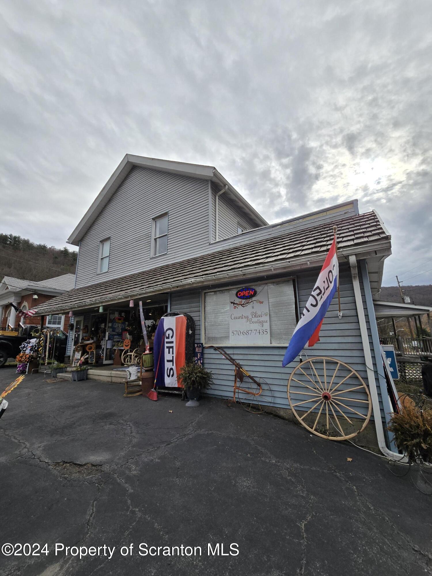 118 Main Street Hop Bottom, PA 18824 - Photo 35 of 35 a view of a garage with parked cars