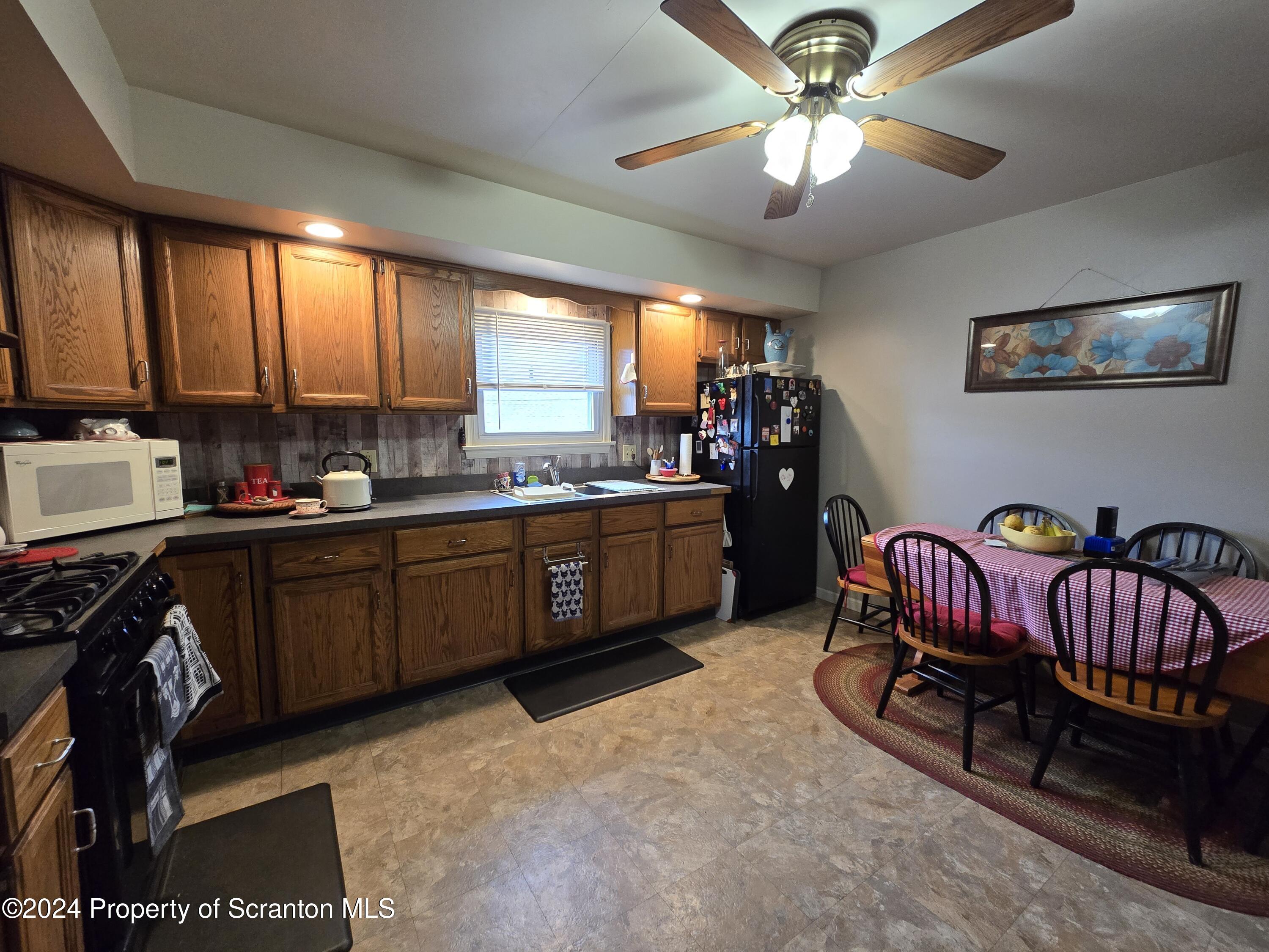 118 Main Street Hop Bottom, PA 18824 - Photo 6 of 35 a kitchen with a sink and cabinets